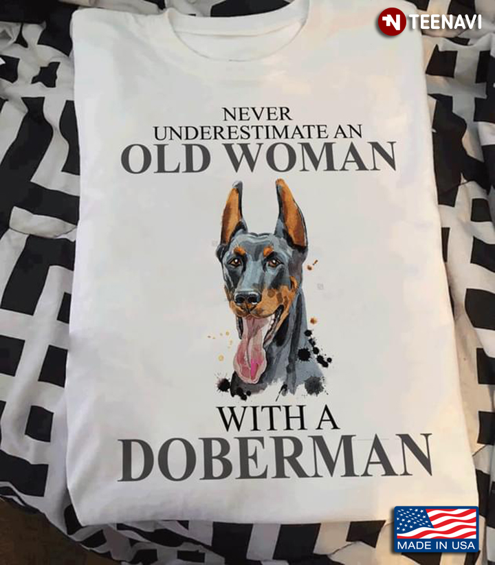 Never Underestimate An Old Woman With A Doberman