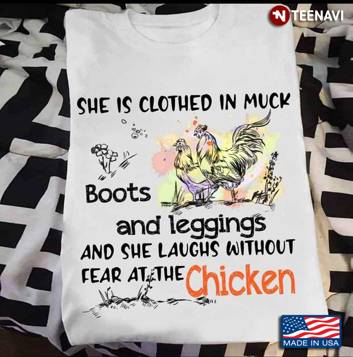 She Is Clothes In Muck Boots and Leggings and She Laughs Without Fear At The Chicken
