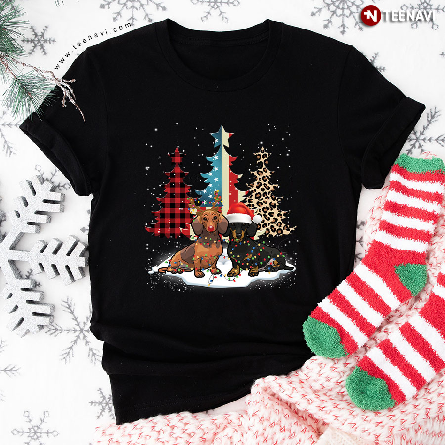 Merry Christmas Dachshunds Standing Beside Xmas Trees American Flag Leopard And Plaid Trees T-Shirt