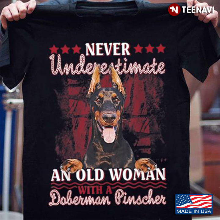 Never Underestimate An Old Woman With A Doberman Pinscher