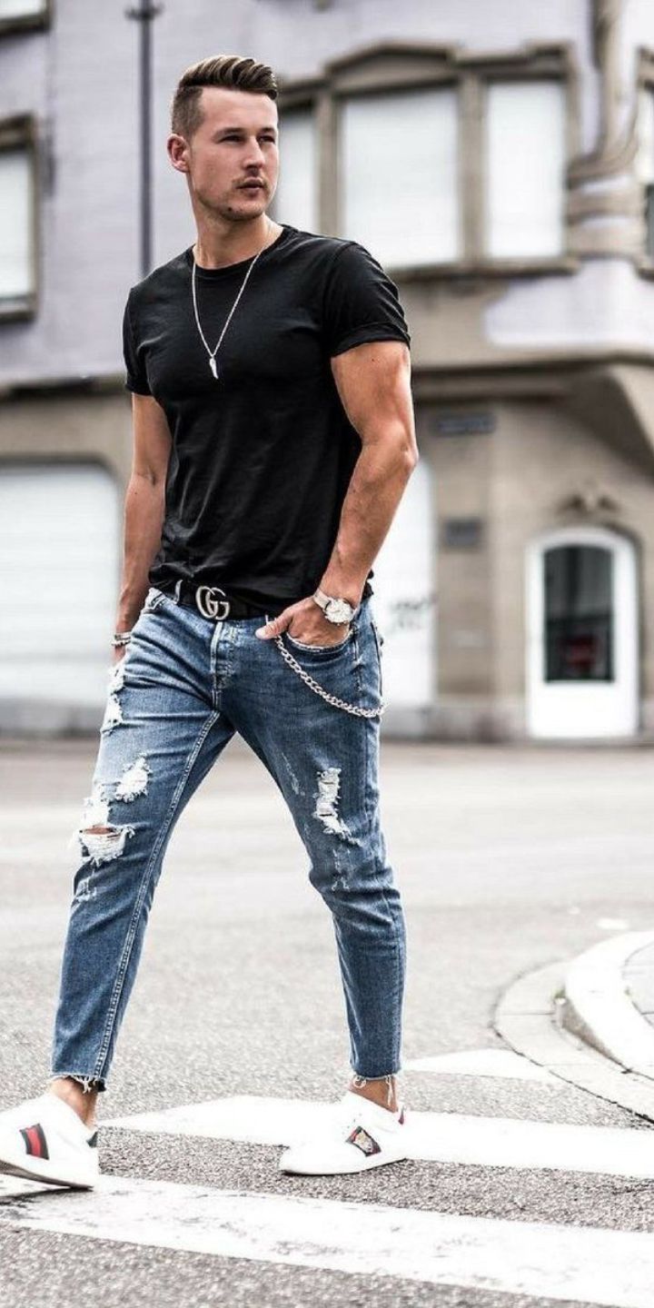 Free Photo | Thoughful muscular black young model in a plain black cotton t- shirt and jeans with his right hand in his back jeans pocket on white wall.