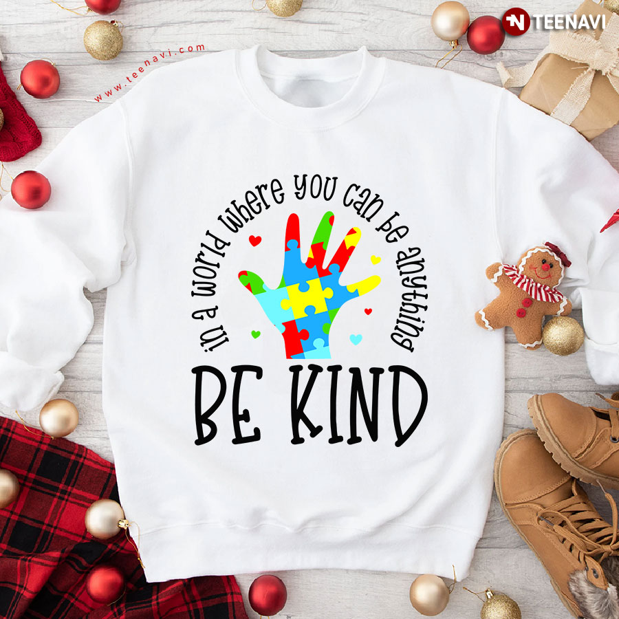 In A World Where You Can Be Anything Be Kind Autism Puzzle Piece Human Hand Heart Sweatshirt